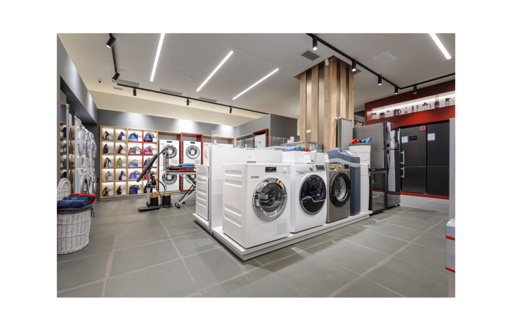 Polished WARN class action. View of washing machines, irons, and other small appliances in an appliance store.