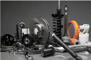First Brands Group and Brake Parts Inc layoff. Close up view of different auto parts: air filters, shocks, etc.