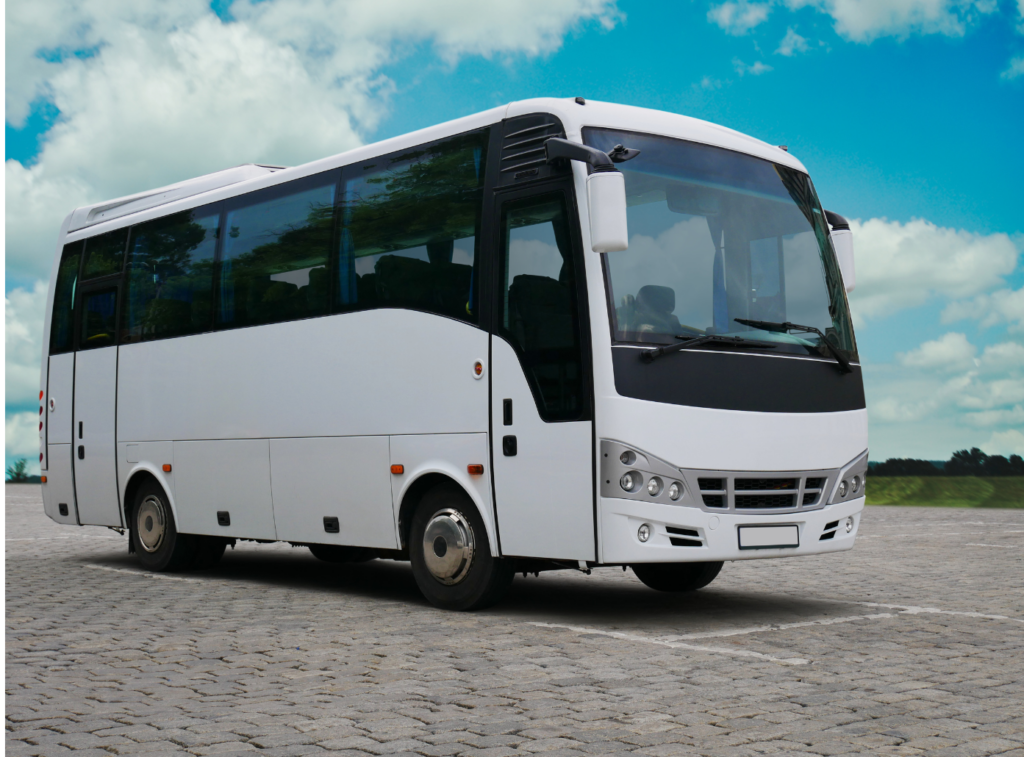 WeDriveU, Inc., a/k/a Diamond Transportation Services, Inc. View of a white modern bus parked in an empty parking lot.
