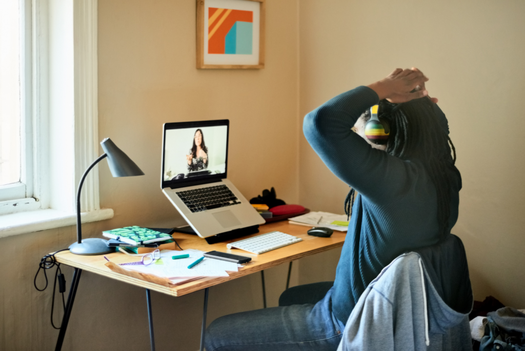 Remote workers, WARN ACT. View of man with dreadlocks working from home during a video conference.