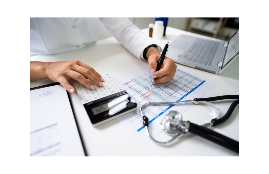 Xtend Healthcare WARN case. View of a person's hands holding a pen and using a calculator. Below the hands are medical billing charts. To the left is a laptop and three pill bottles. In the foreground, a stethoscope lies on the desk.