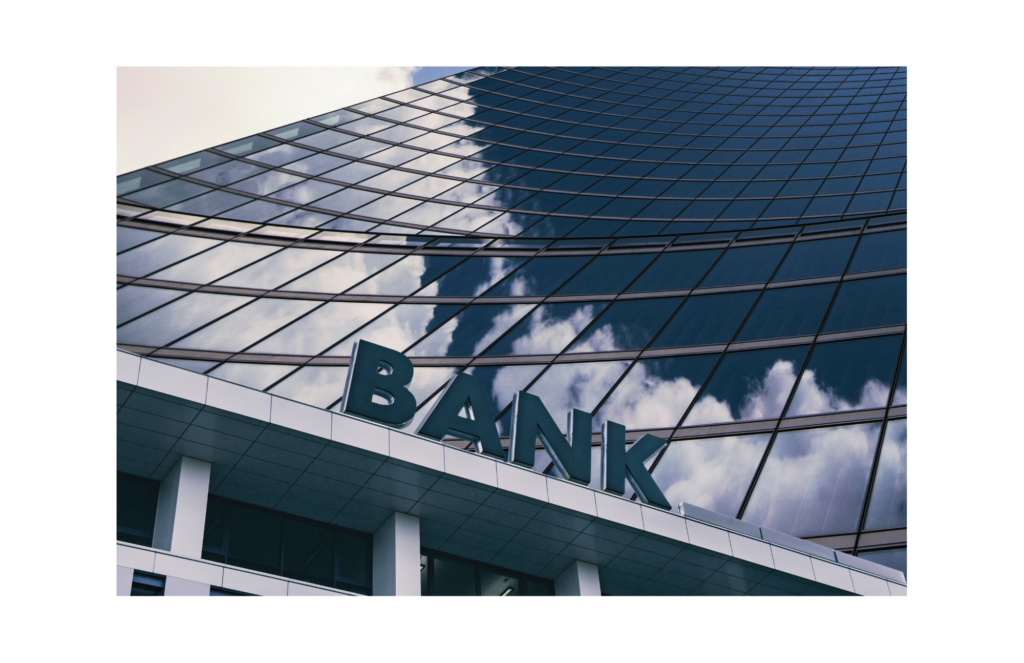 Alliance Bancorp WARN class action. View of the word BANK spelled out on a ledge protruding from a lower floor of a skyscraper.