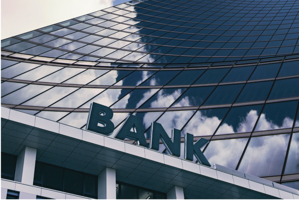Alliance Bancorp WARN class action. View of the word BANK spelled out on a ledge protruding from a lower floor of a skyscraper.