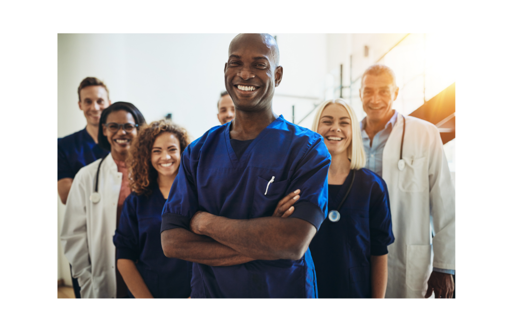Prospect Crozer WARN class action. View of a medical staff standing in three rows. They are all wearing surgical scrubs and/or white lab coats. Most have stethoscopes over their shoulders.