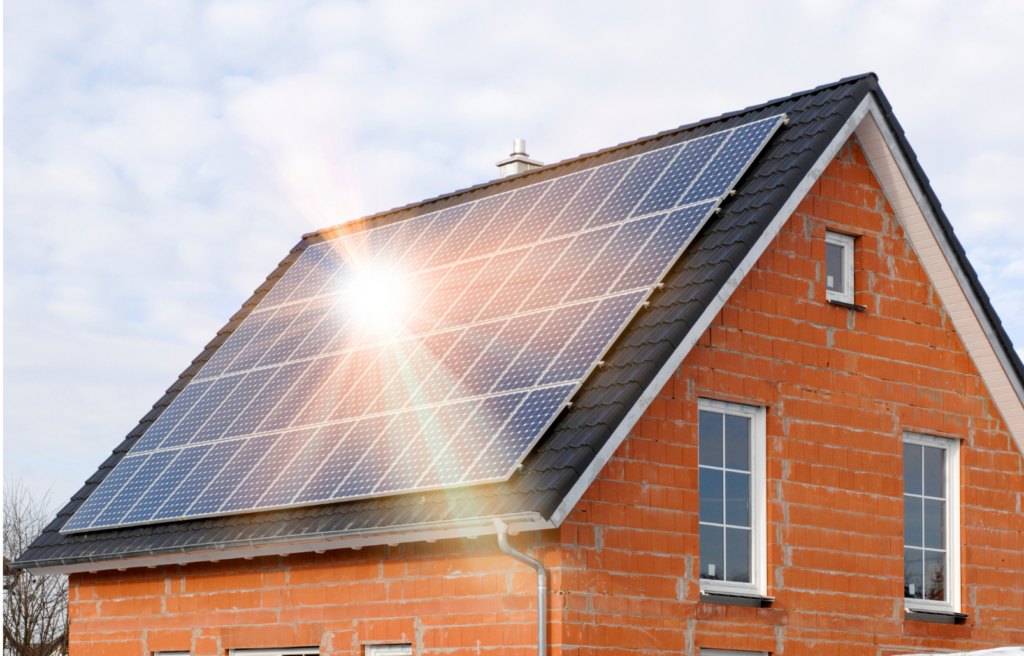 Level Solar WARN class action. View of a brick building with solar panels glinting in the sun as shown on the angled side of the roof that is shown in the photograph. There are several new windows apparent in the picture.