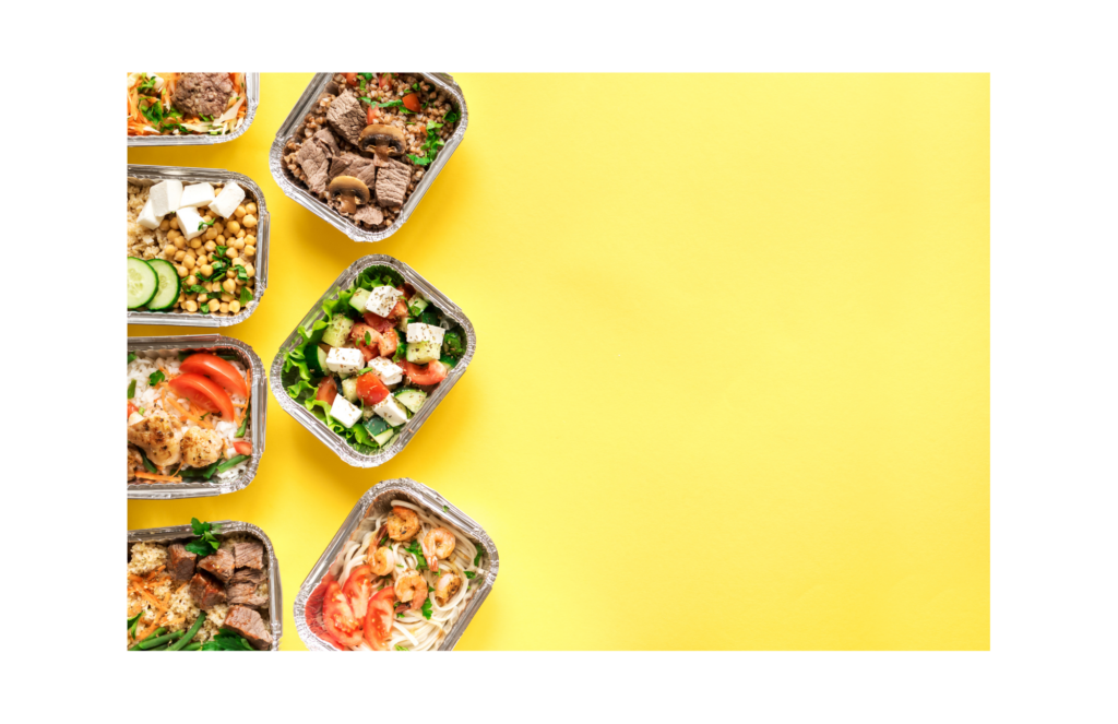 Munchery WARN class action. View of seven colorful prepared meals in single serve foil containers displayed on the left of a bright yellow background.