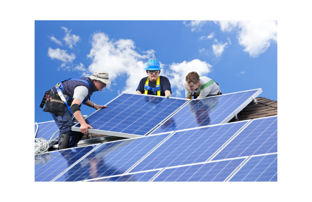 Sungevity WARN class action. View of a crew of three men in construction gear--tool belts held up with large colorful suspenders (one in blue suspenders, one green, and one yellow) installing solar panels on a shingled roof. One worker is wearing a blue hard hat.