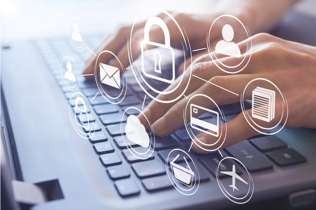 USIS WARN class action. Close up view of hands on a laptop keyboard. With images superimposed above the hands showing icons for a padlock, credit card, airplane, email, documents, and people.